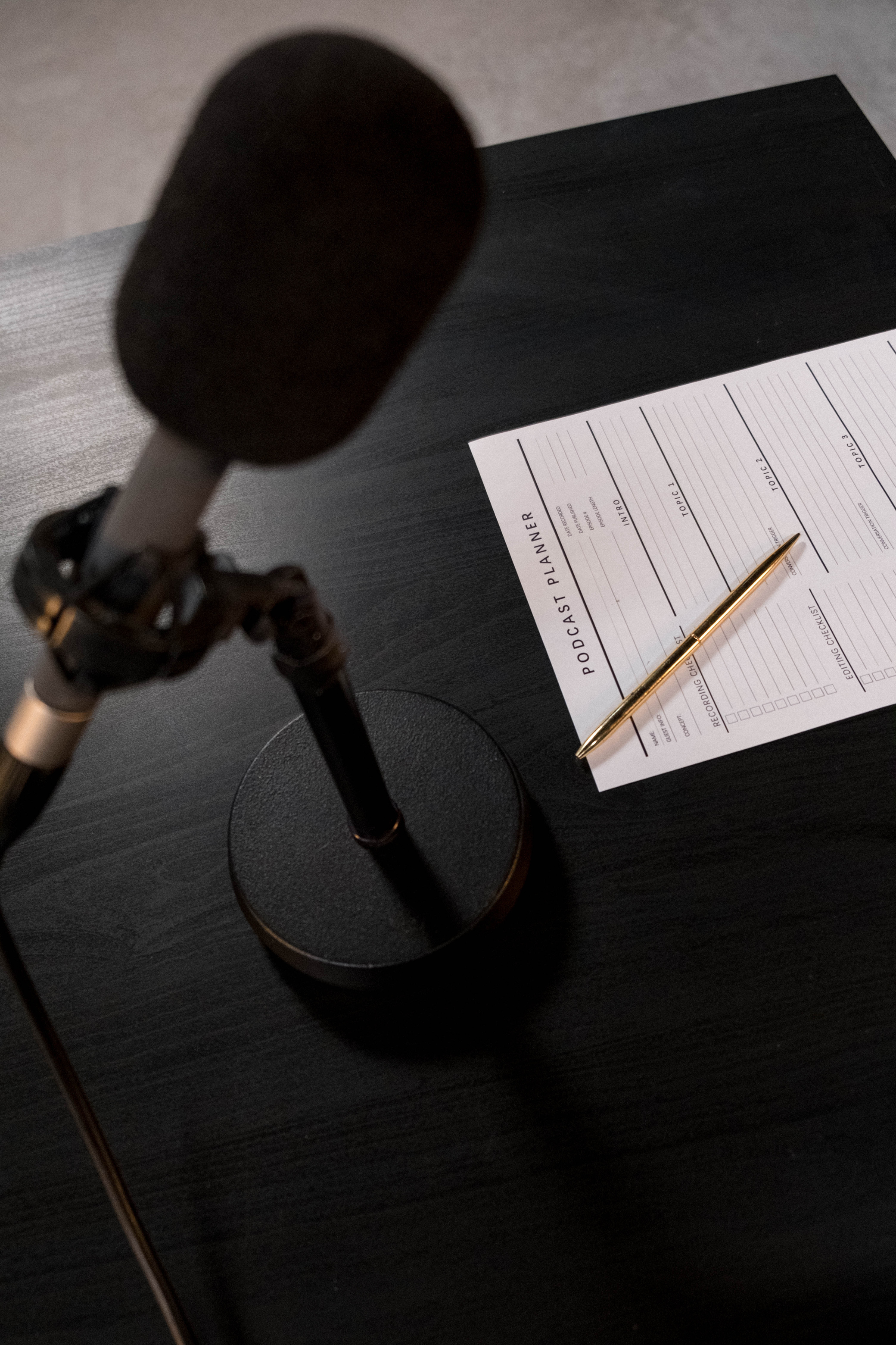 Black and Gray Microphone on White Paper